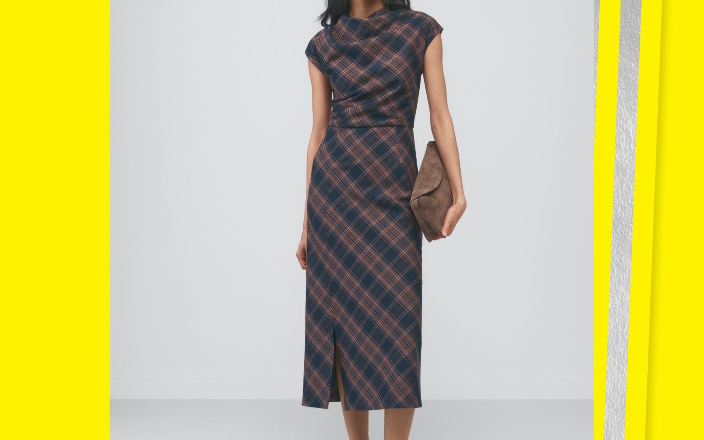 A woman in a plaid midi dress.