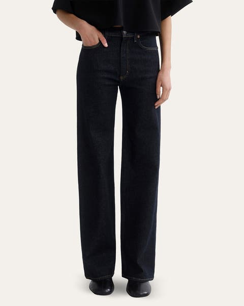 A woman wearing a pair of straight-leg denim.