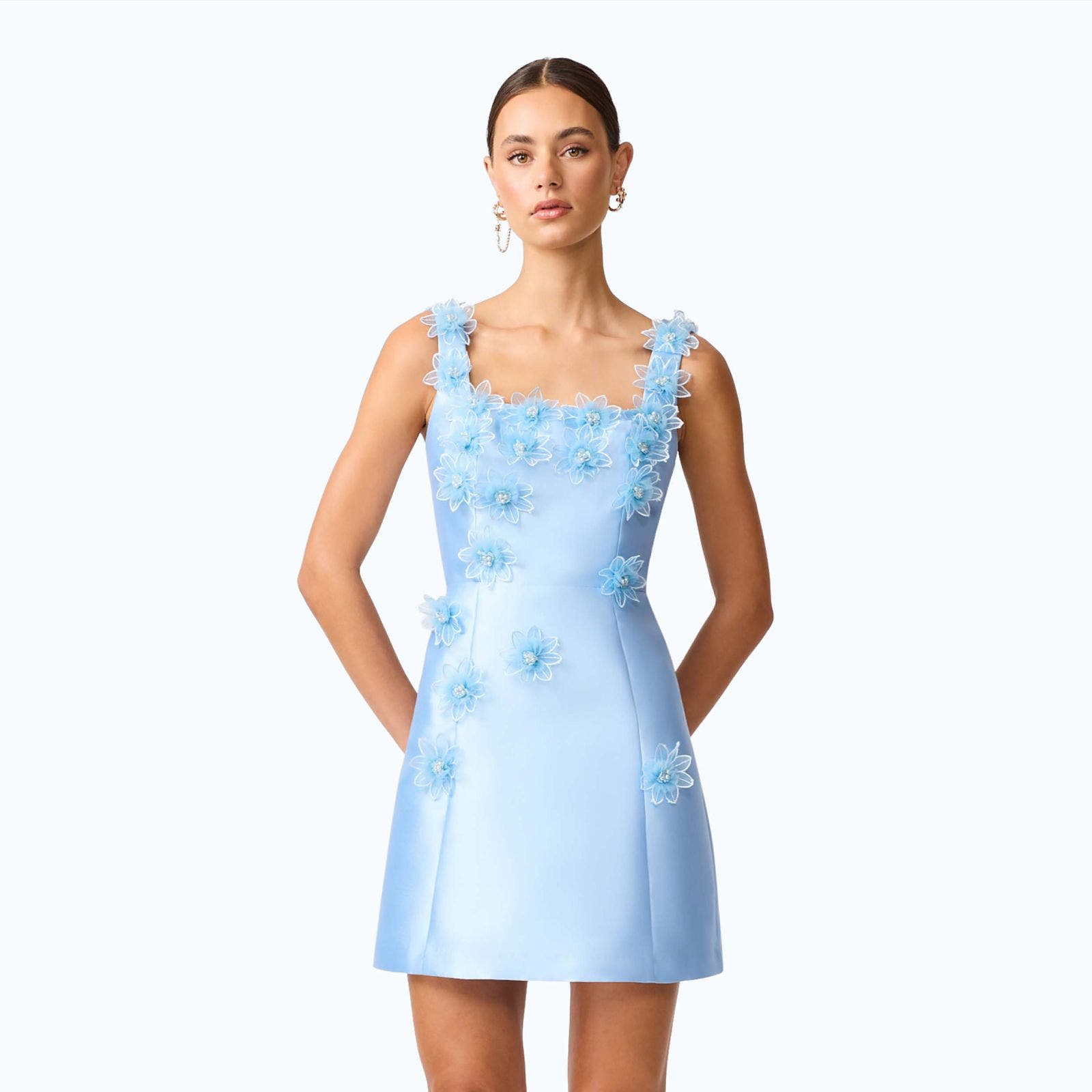 A woman wearing a semi-formal blue mini dress.