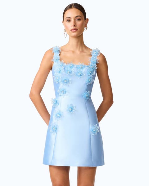 A woman wearing a semi-formal blue mini dress.
