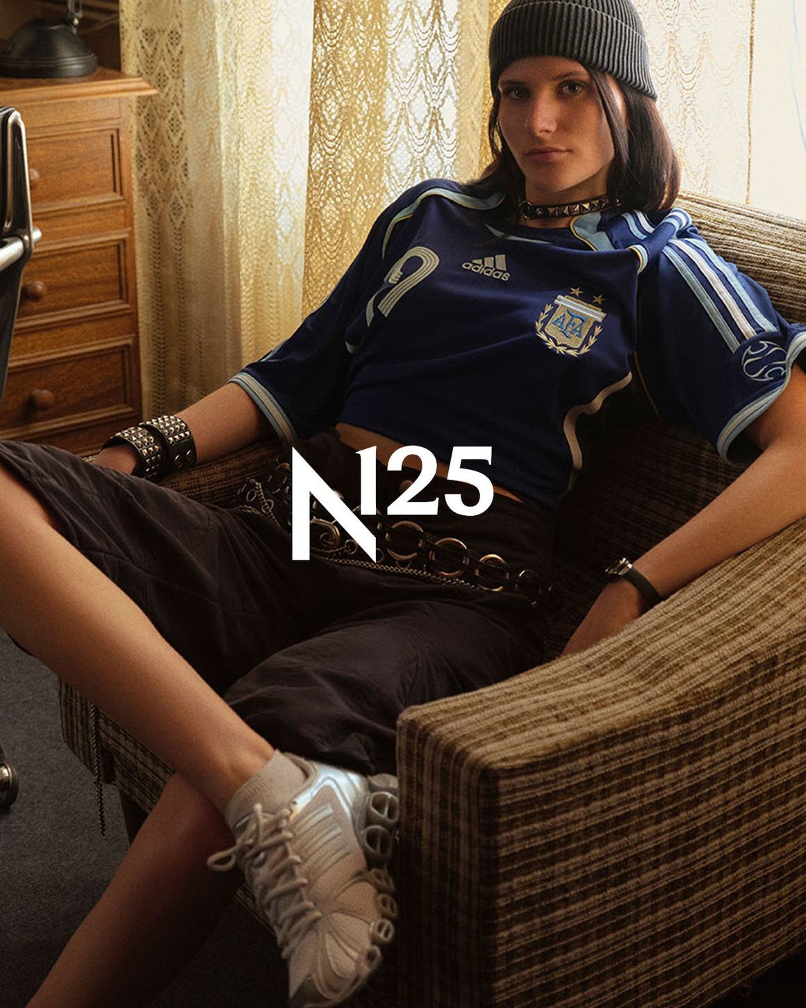 Woman wearing adidas apparel and sneakers, part of Nordstrom's 125th celebration.