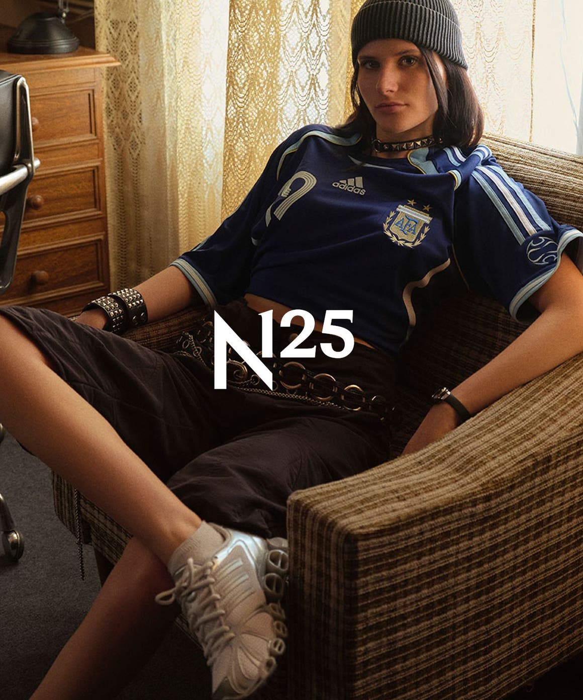 Woman wearing adidas apparel and sneakers, part of Nordstrom's 125th celebration.