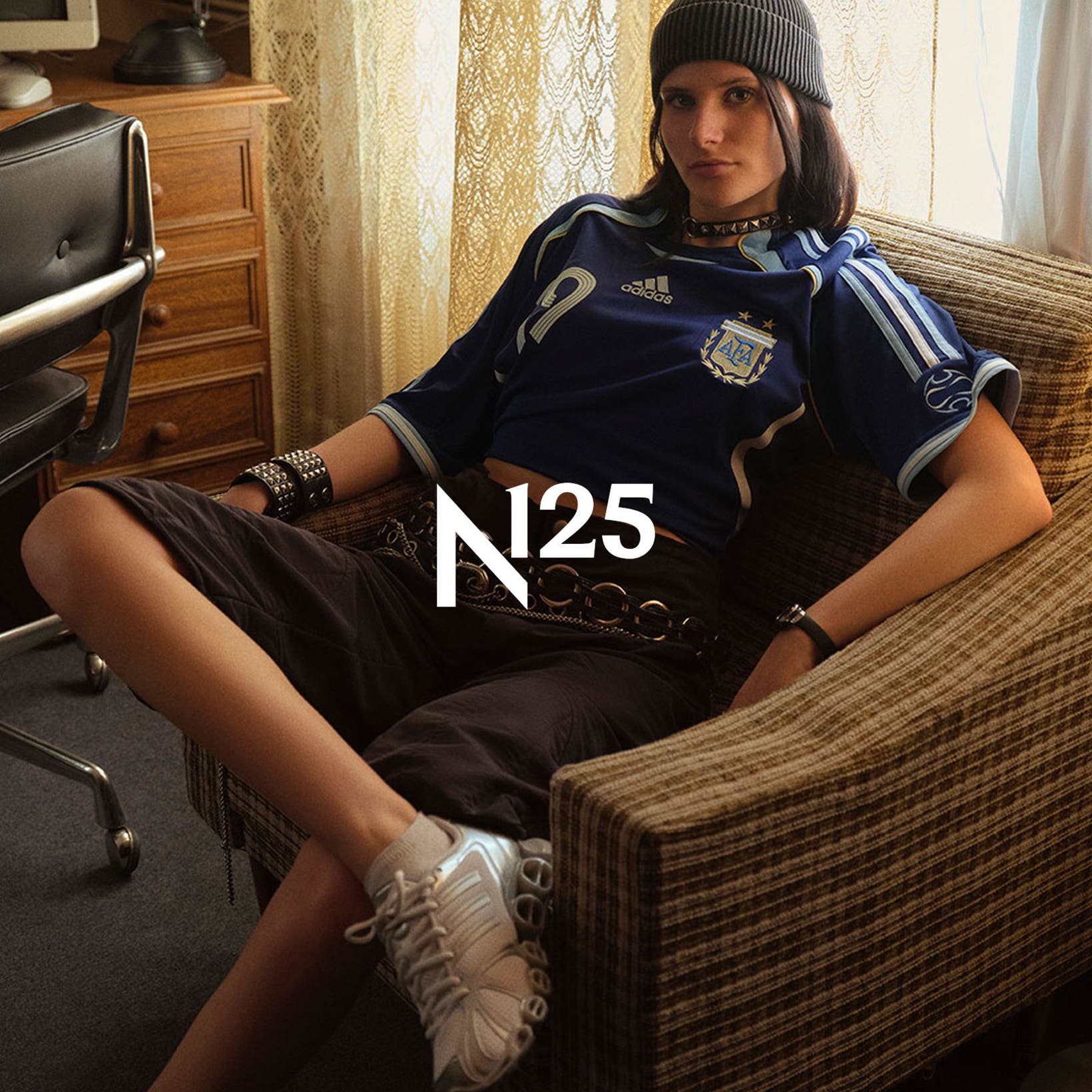 Woman wearing adidas apparel and sneakers, part of Nordstrom's 125th celebration.