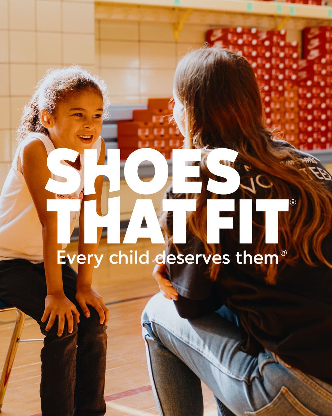 Shoes That Fit; a child trying on new shoes.
