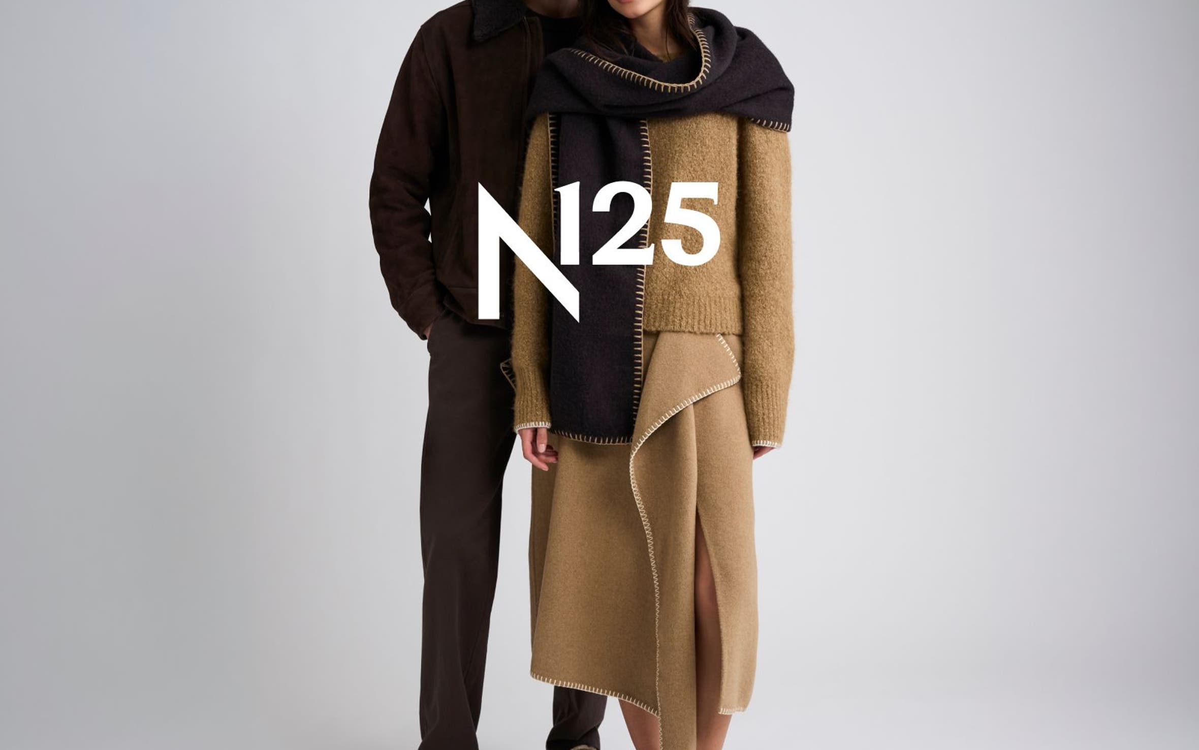 Two models in coordinated brown and camel cold-weather outfits with the white N25 logo overlaid