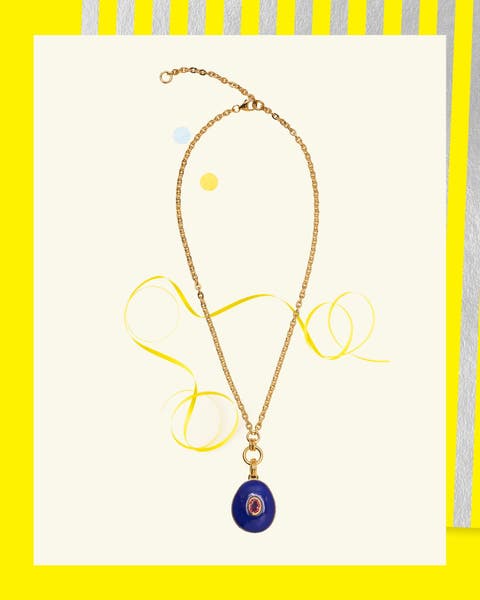 Gold chain necklace with blue lapis pendant and pink center stone.