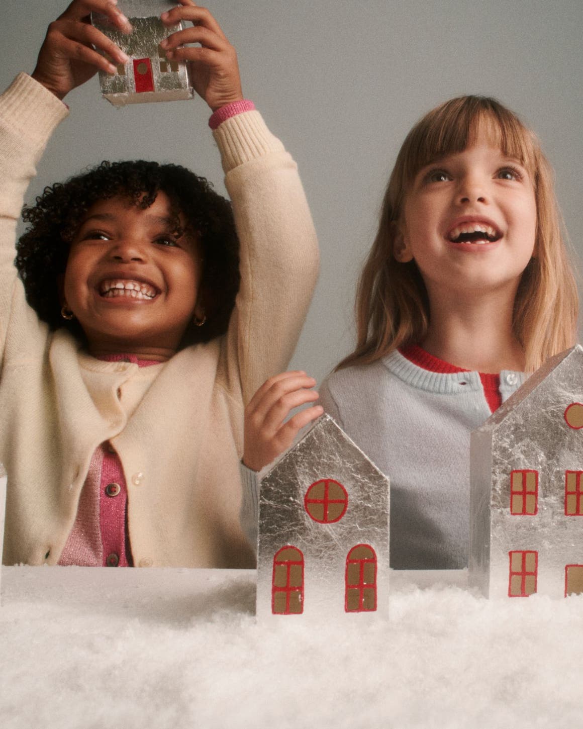 Children playing with holiday decor.