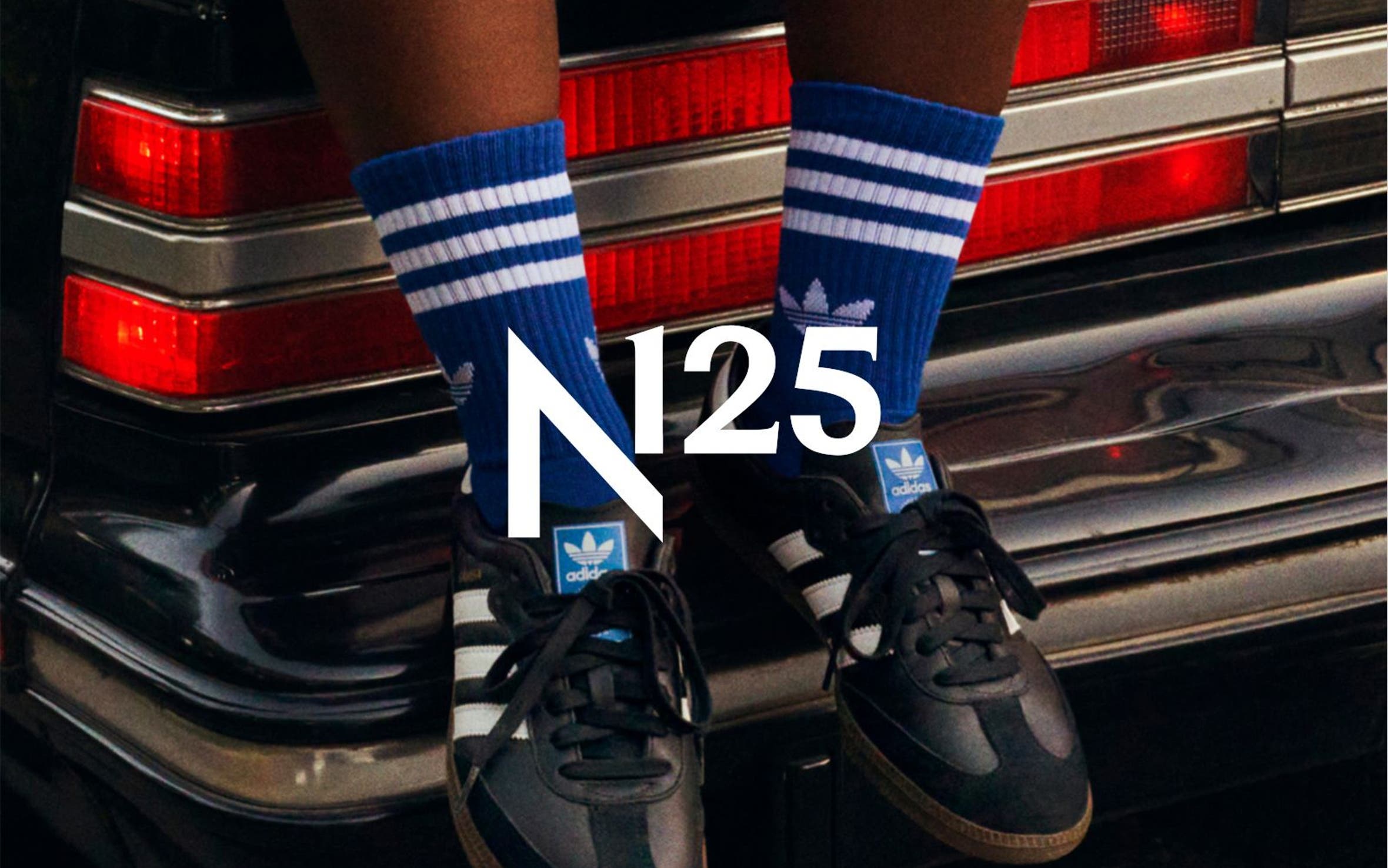 A person wearing adidas sneakers, part of Nordstrom's 125th celebration.