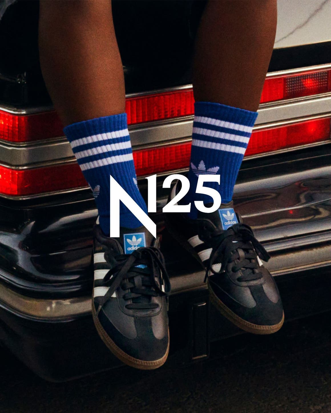 A person wearing adidas sneakers, part of Nordstrom's 125th celebration.