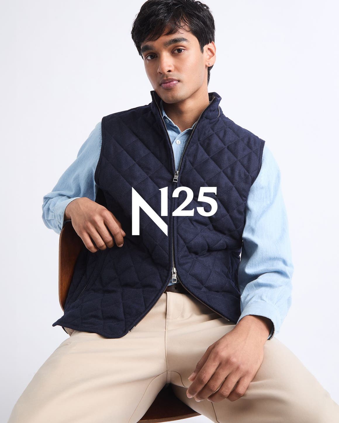 A man wearing Peter Millar vest.