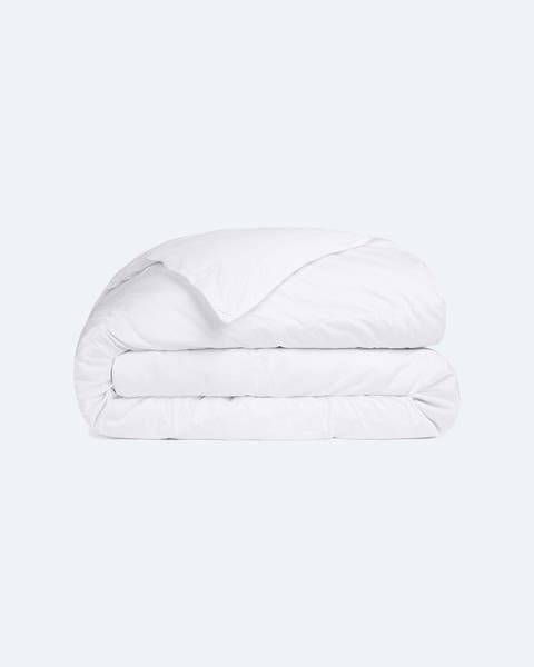 A folded white down comforter.