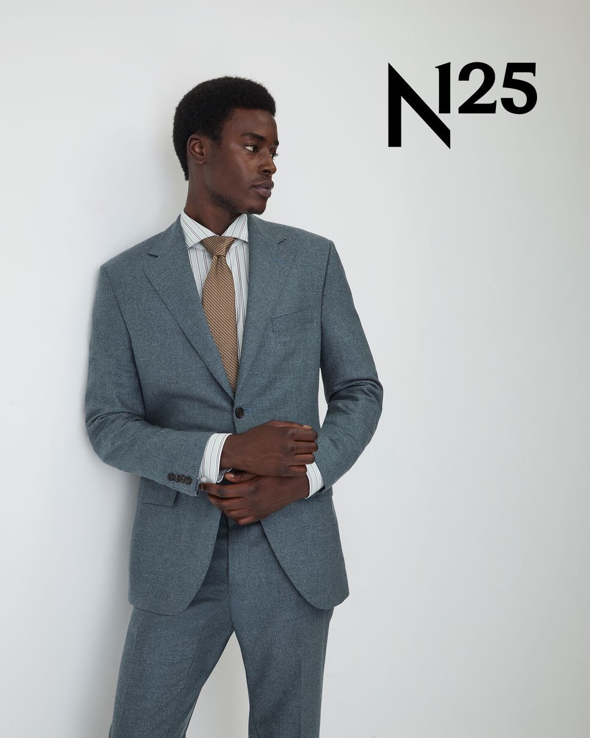 Man wearing Peter Millar suit, dress shirt, and tie.