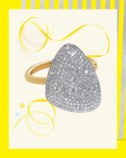 Pavé diamond ring with triangular face set in gold band.