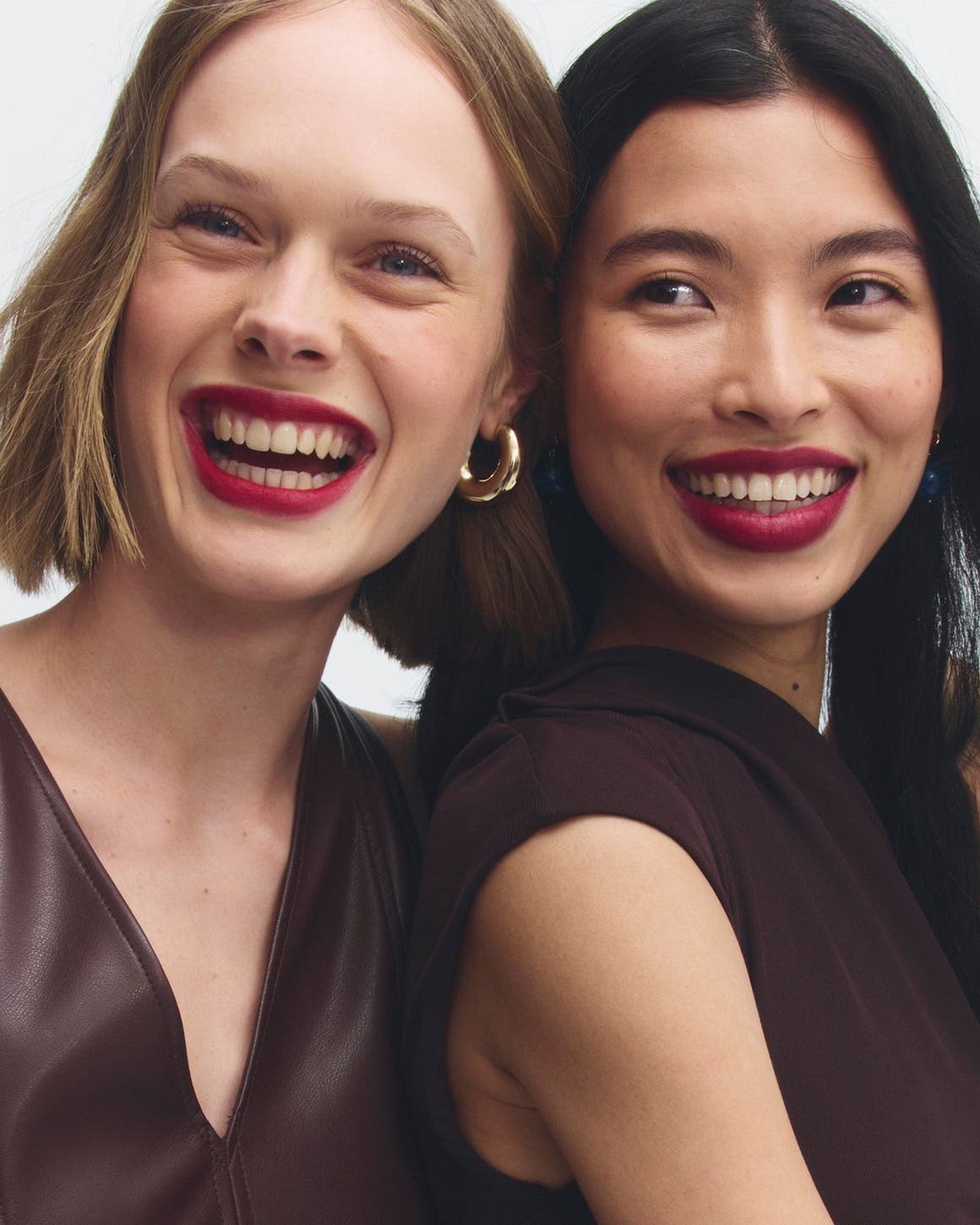 Early Access beauty exclusives: two women with red lips.