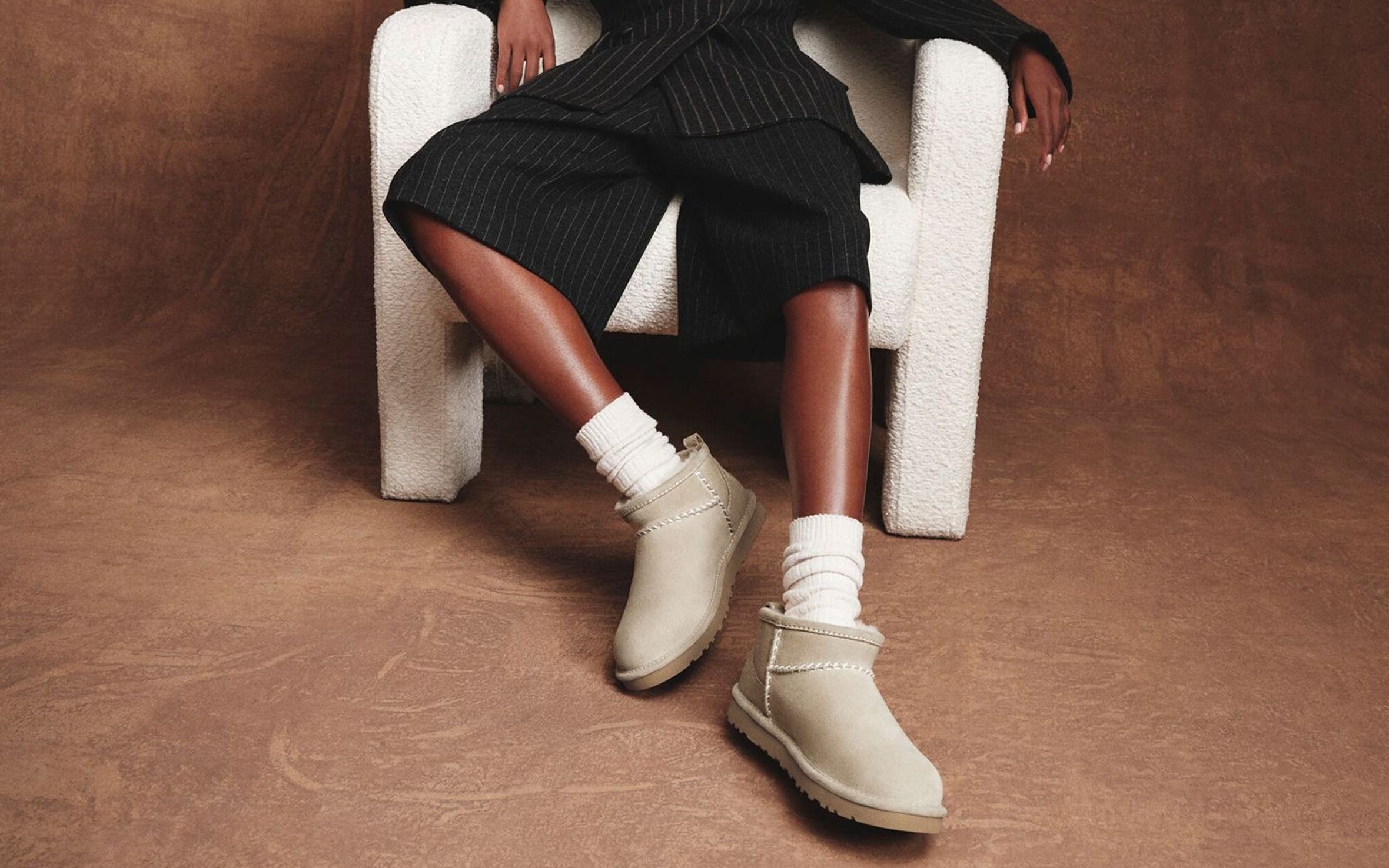 Woman wearing UGG shoes.