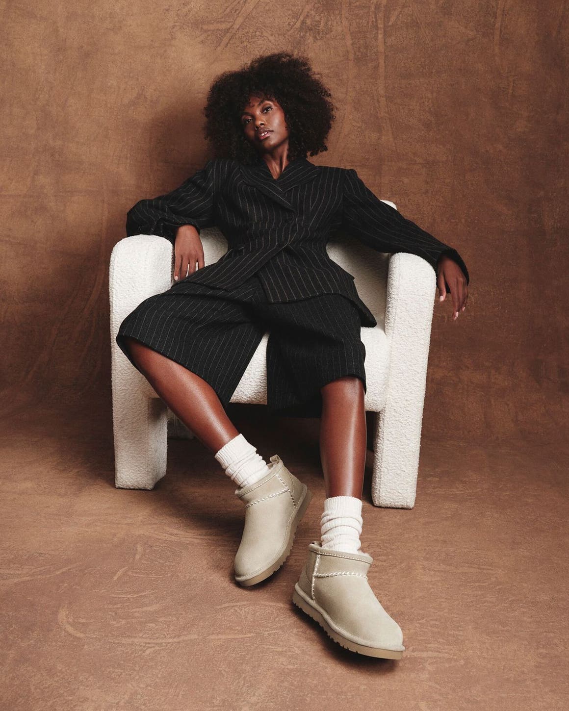 Woman wearing UGG shoes.