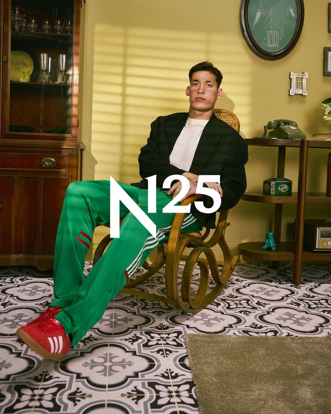 A man wearing adidas apparel and sneakers, part of Nordstrom's 125th celebration.