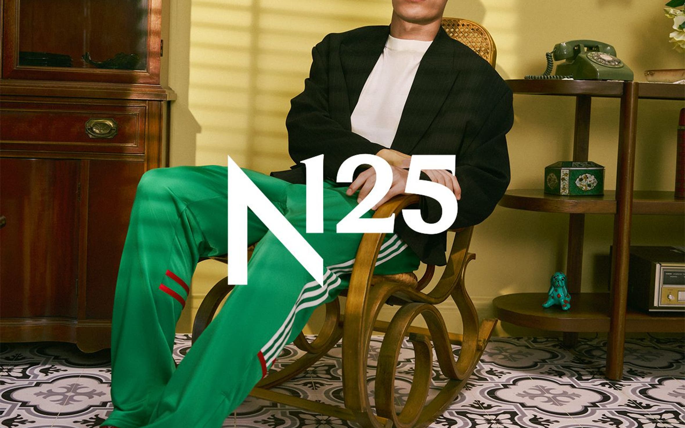A man wearing adidas apparel and sneakers, part of Nordstrom's 125th celebration.