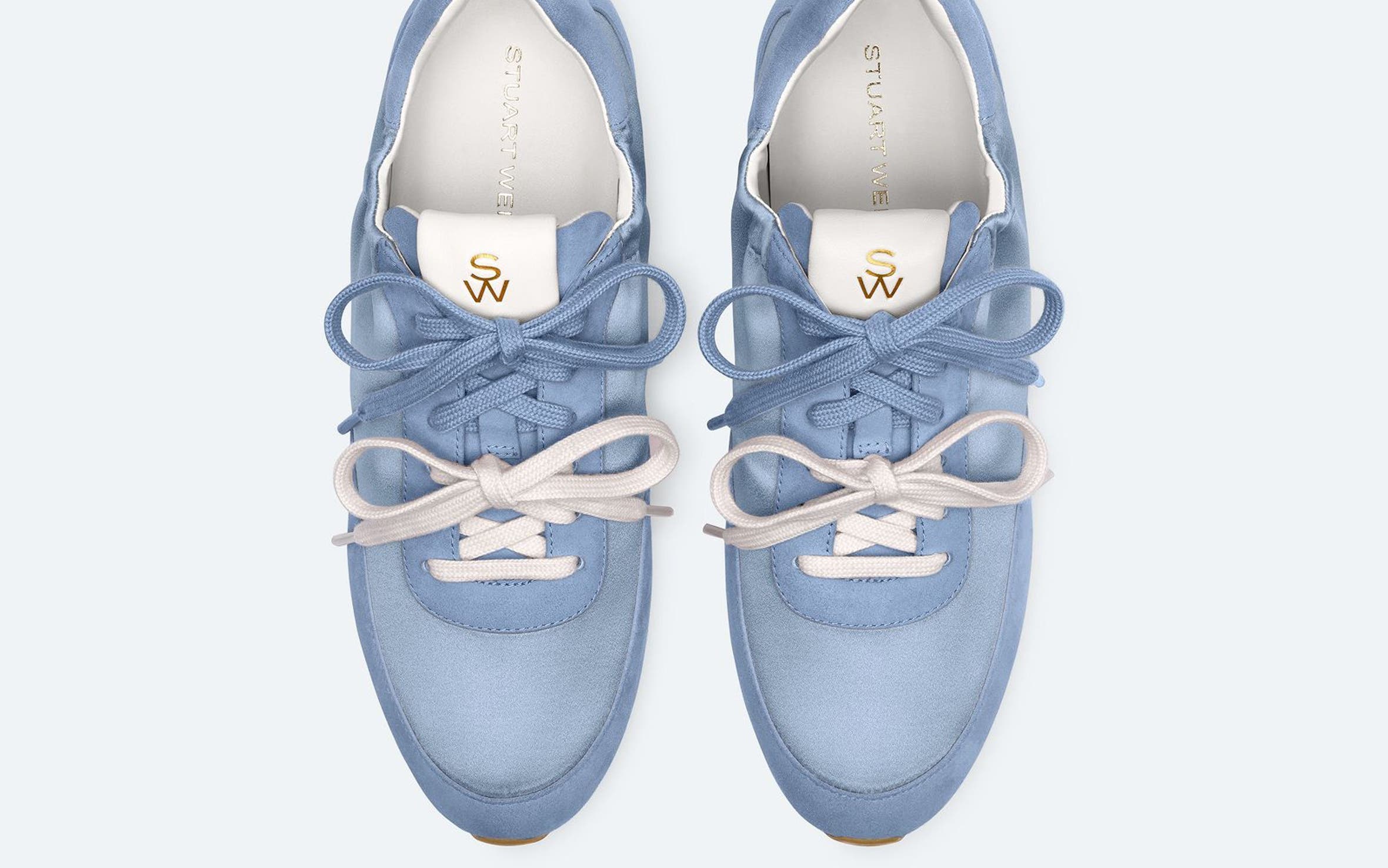 Blue Stuart Weitzman sneakers with blue and white double laces