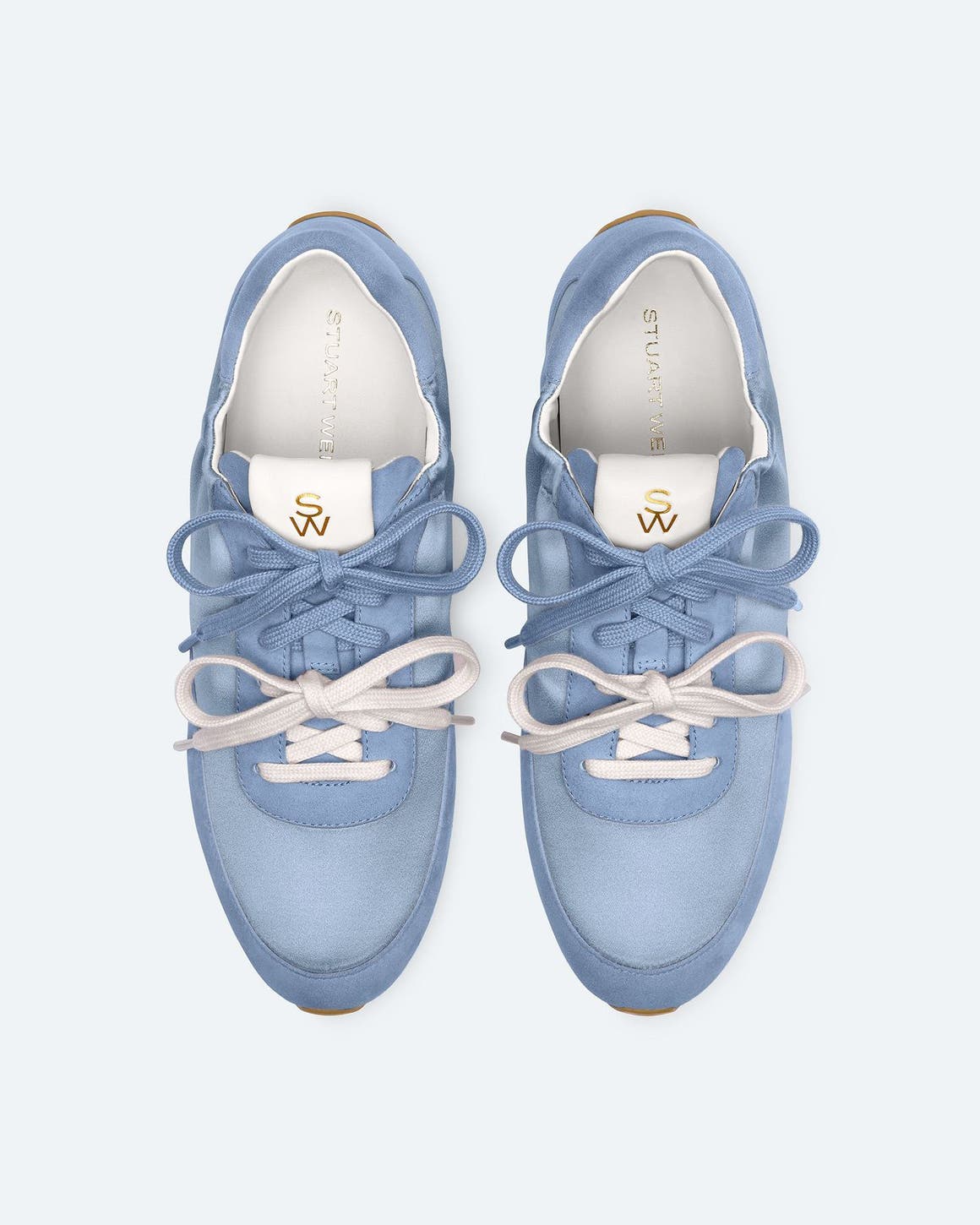 Blue Stuart Weitzman sneakers with blue and white double laces