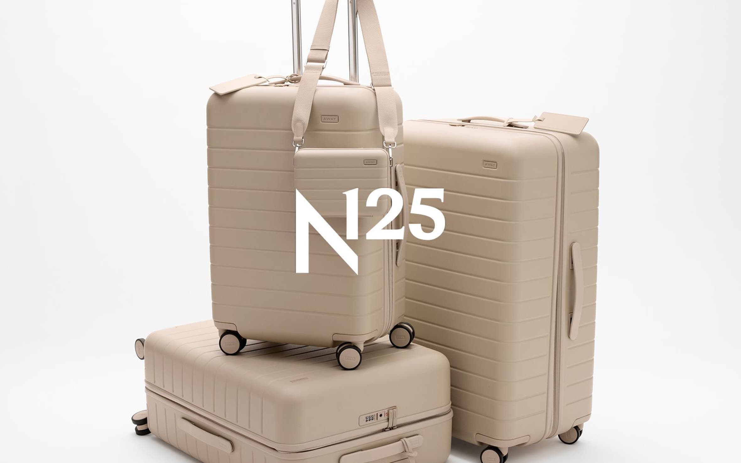 A set of beige luggage.