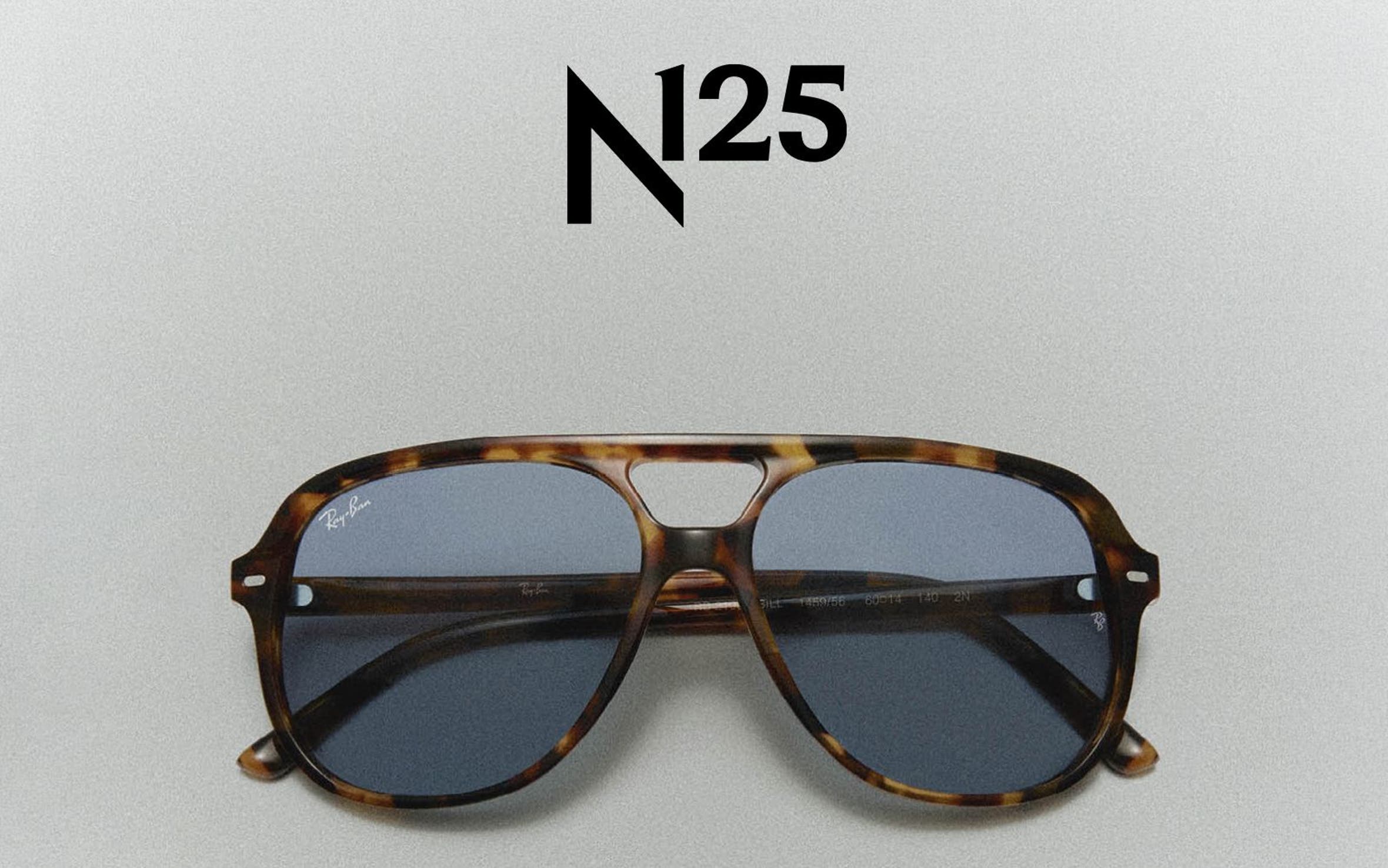 Classic tortoise-shell Ray-Ban sun glasses and the Ray-Ban logo.