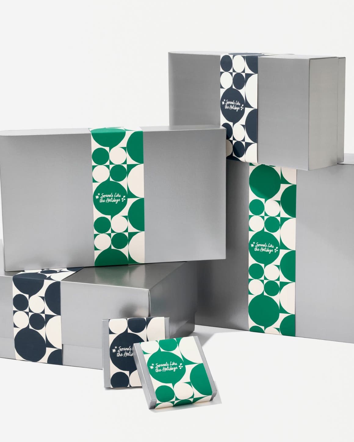 Silver Nordstrom gift boxes in various sizes.