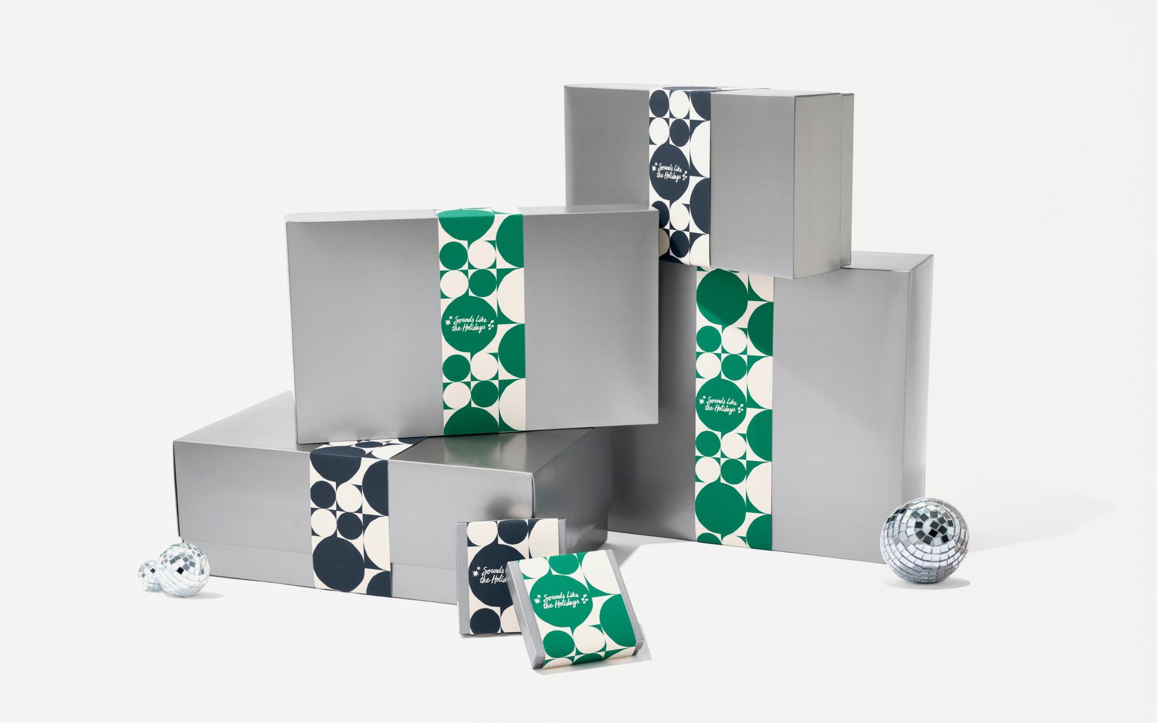 Silver Nordstrom gift boxes in various sizes.