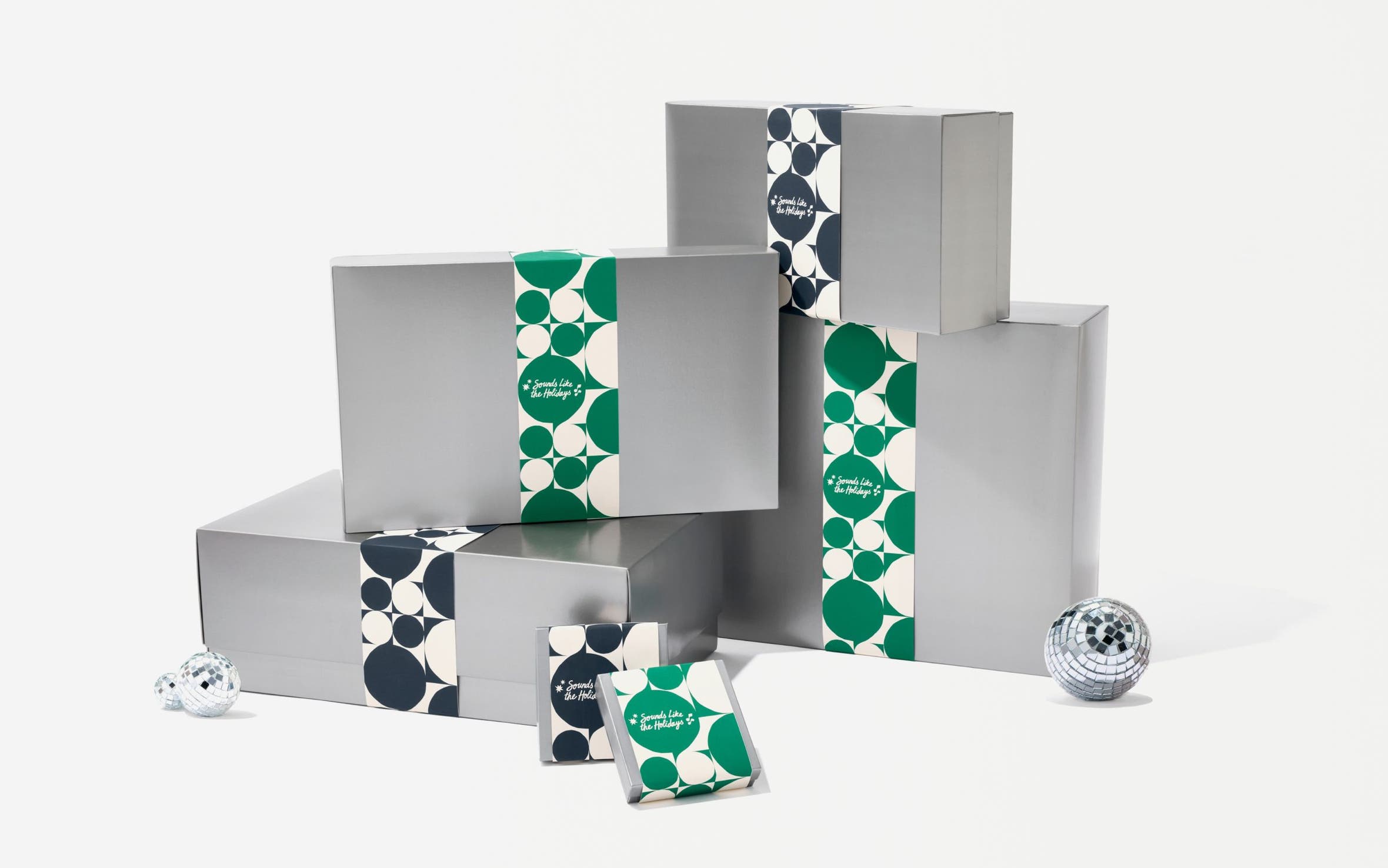 Silver Nordstrom gift boxes in various sizes.
