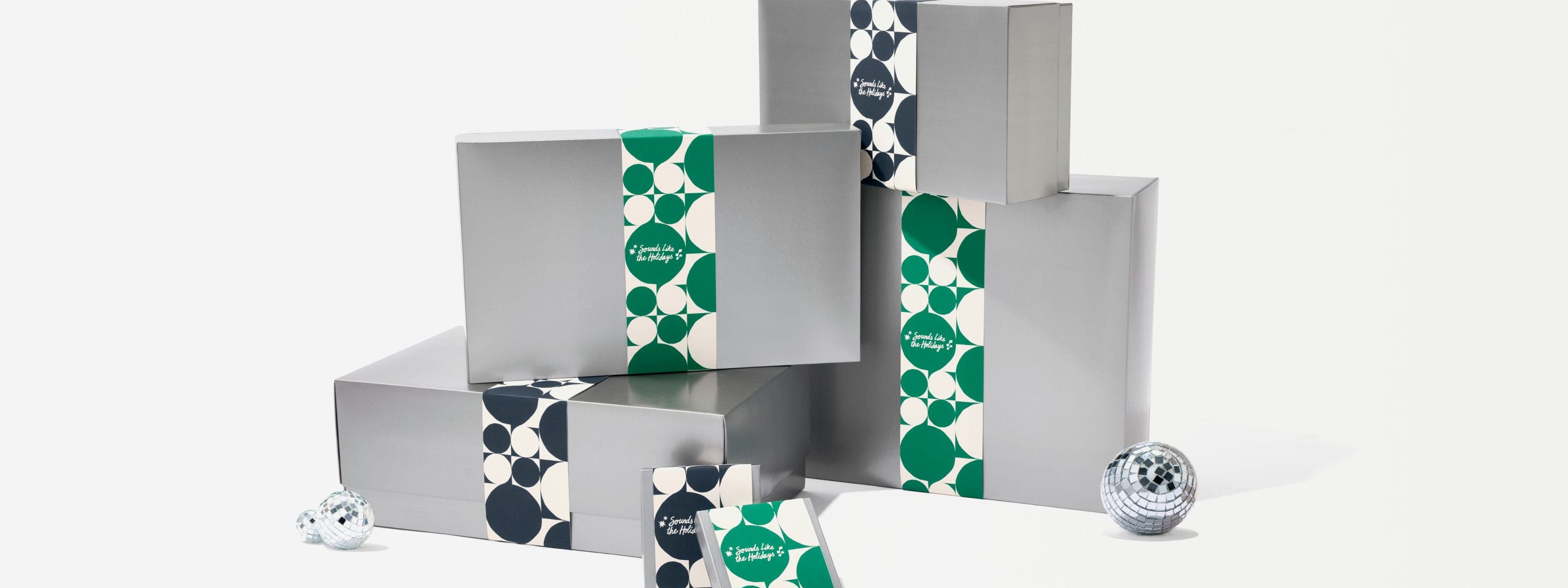 Silver Nordstrom gift boxes in various sizes.