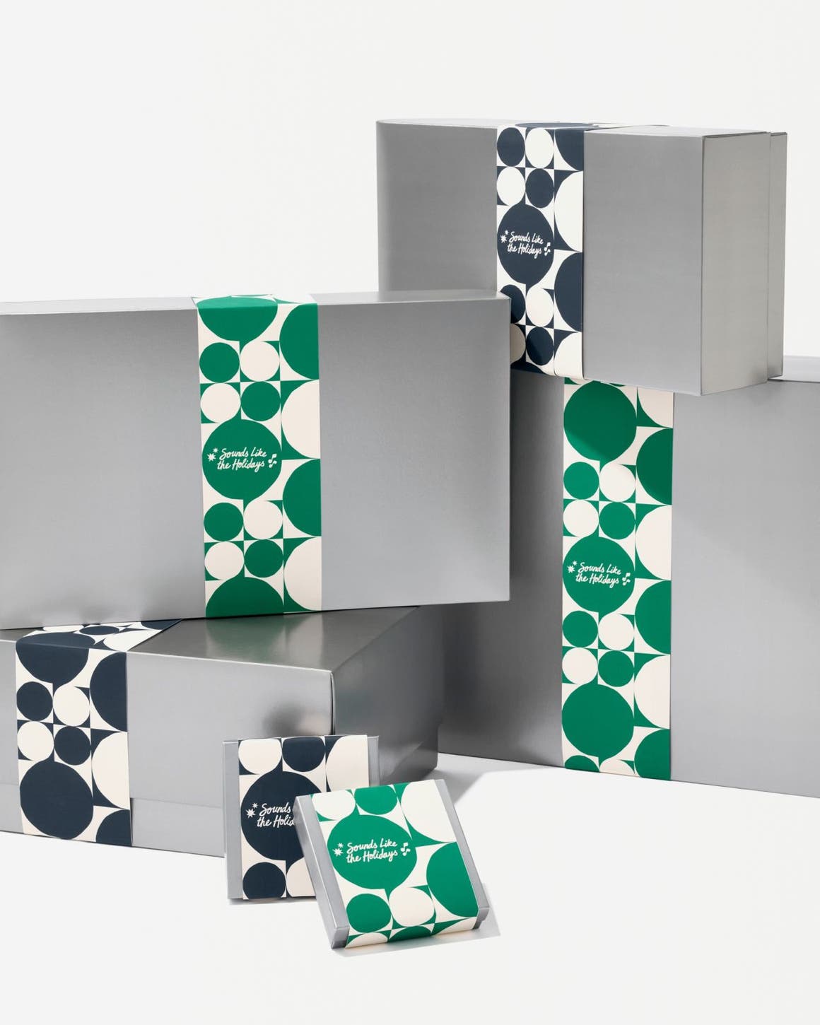 Silver Nordstrom gift boxes in various sizes.