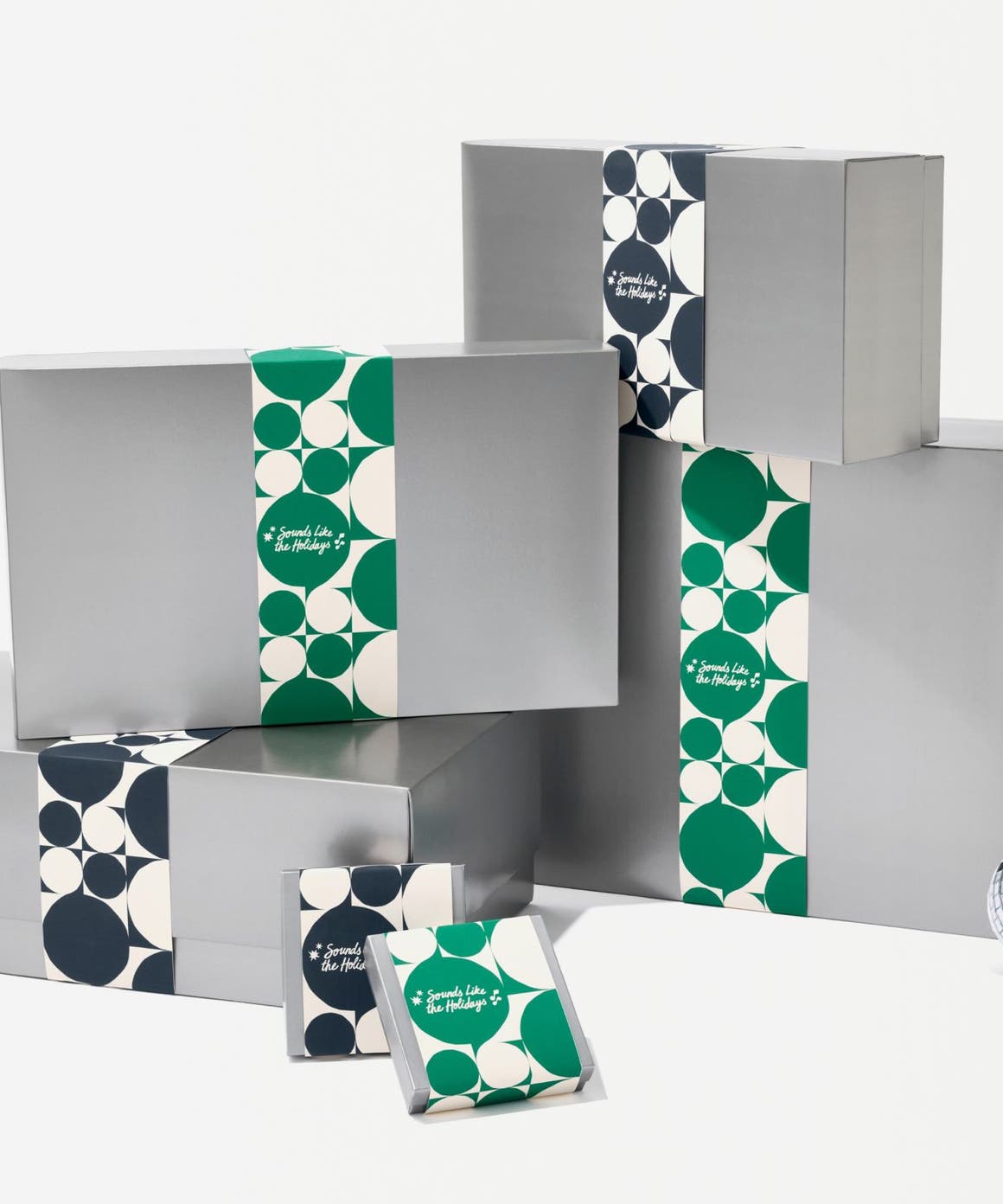 Silver Nordstrom gift boxes in various sizes.