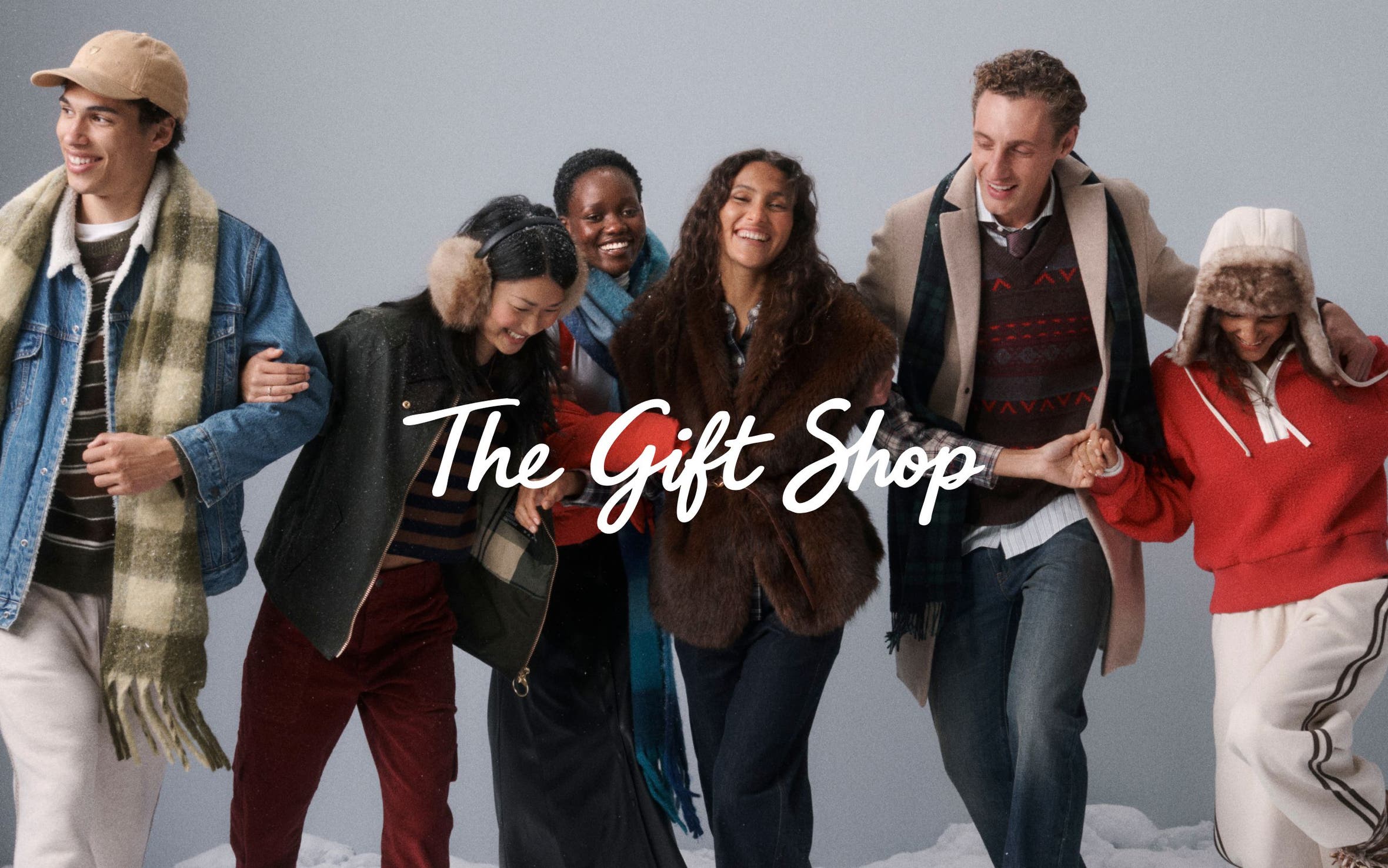 The gift shop. Men and women in winter outerwear.