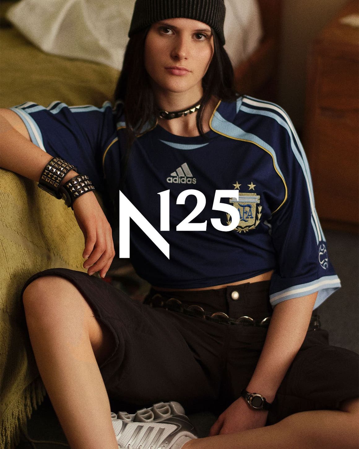 A woman wearing adidas apparel and sneakers, part of Nordstrom's 125th celebration.