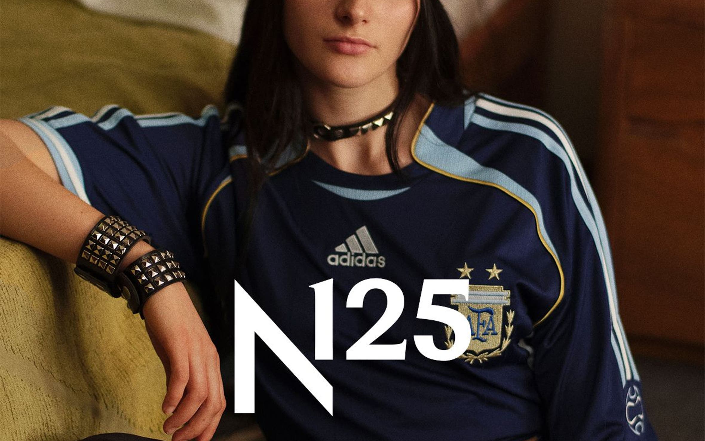 A woman wearing adidas apparel and sneakers, part of Nordstrom's 125th celebration.