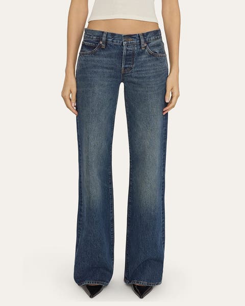 A woman wearing a pair of low-rise denim.
