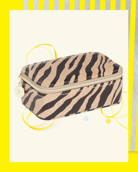 Tiger-print zip jewelry case with gold zipper pull.
