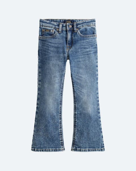 A pair of boot-cut denim jeans for little girls.
