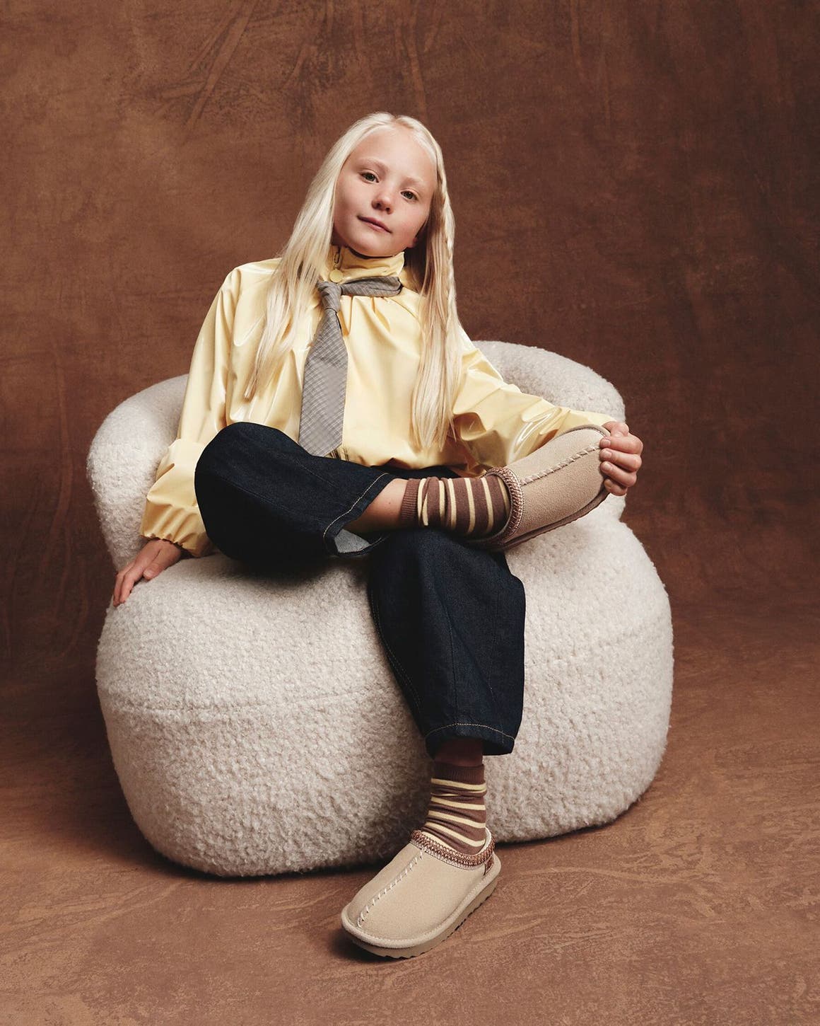 Young girl wearing UGG shoes.