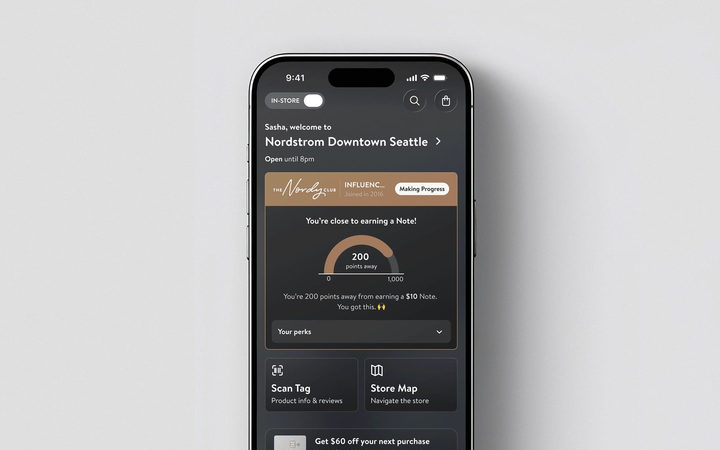 Phone screen with loyalty status.