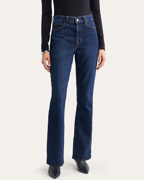 A woman wearing a pair of bootcut denim.