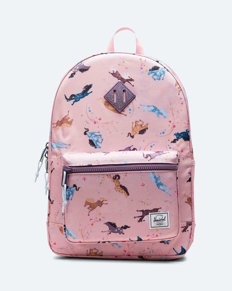 A pink backpack with horses.