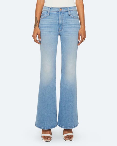 A women in light wash bootcut jeans.