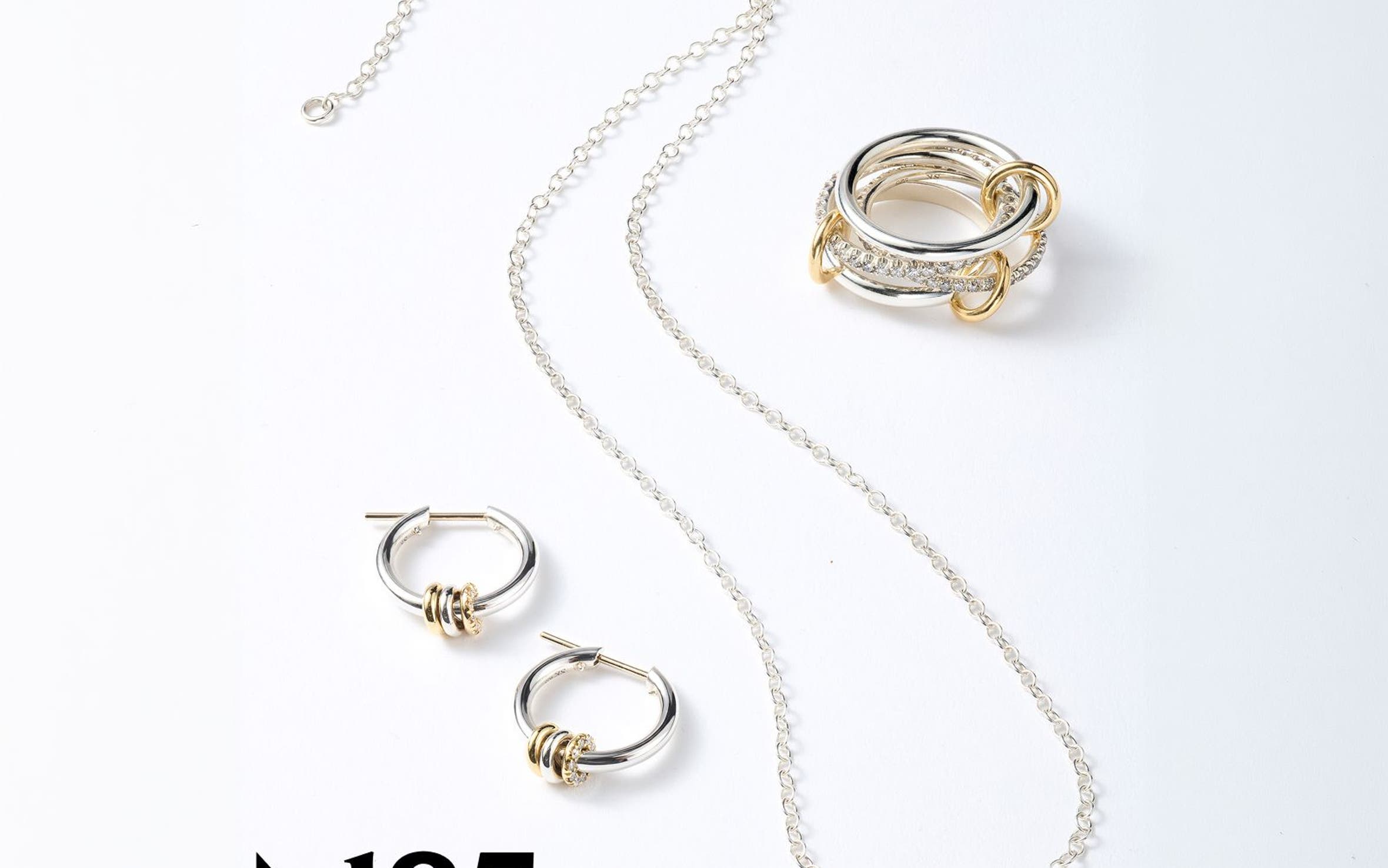A necklace, ring and pair of silver and gold earrings. 
