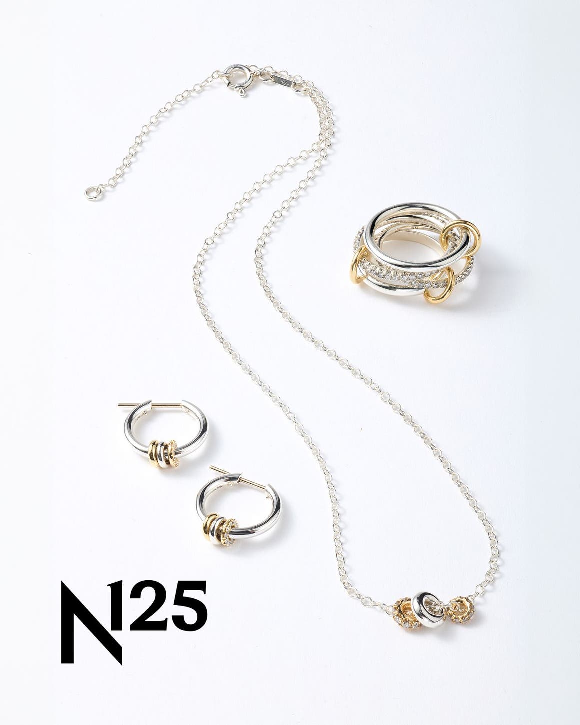 A necklace, ring and pair of silver and gold earrings. 
