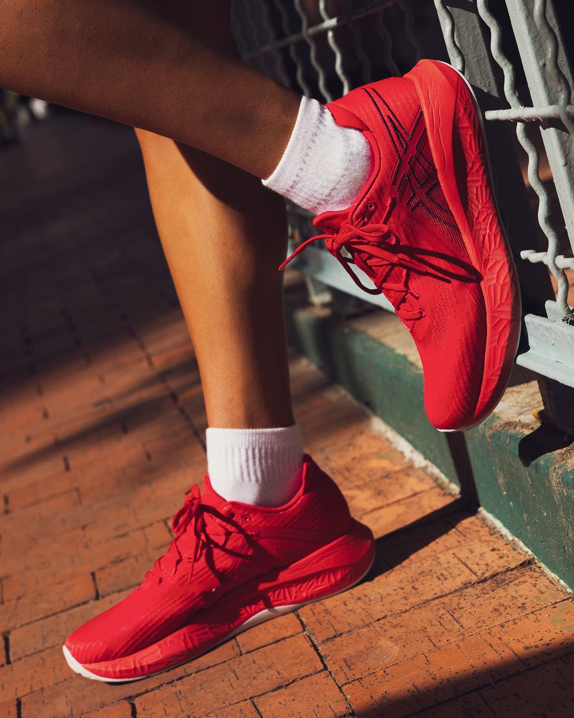 ASICS® sneakers.