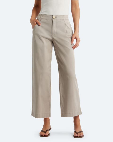 A woman in cropped wide-leg khaki pants.