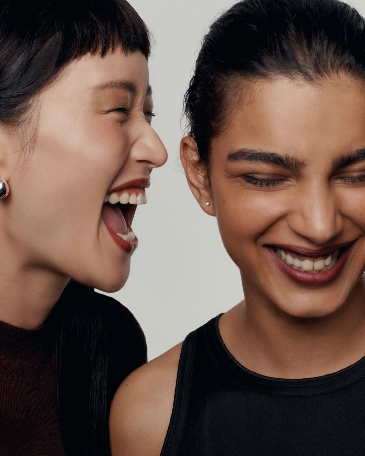 Two women laughing.