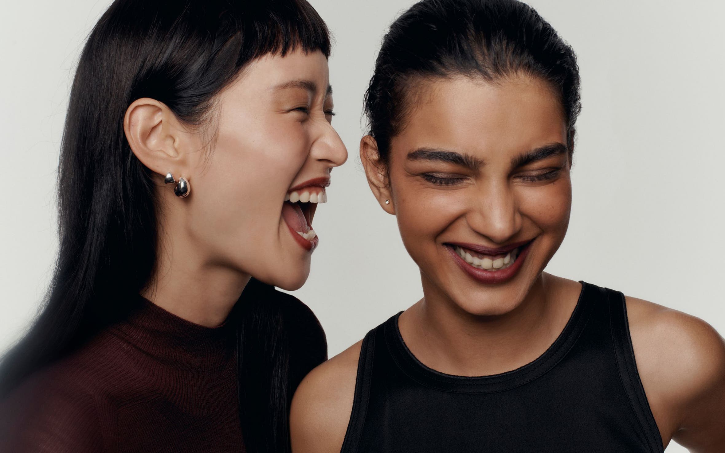 Two women laughing.