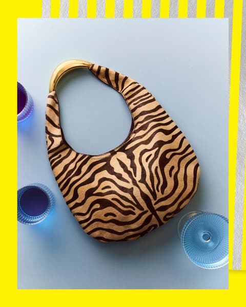 A brown tiger striped hand bag.